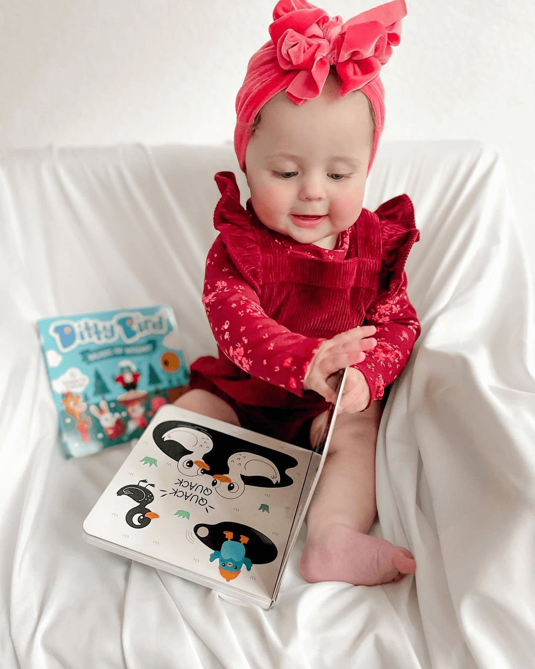 Baby Enjoying Ditty Bird Black & White Animals